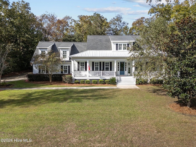 view of front of house with a porch and a front yard