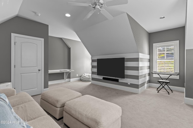 carpeted living room featuring vaulted ceiling and ceiling fan