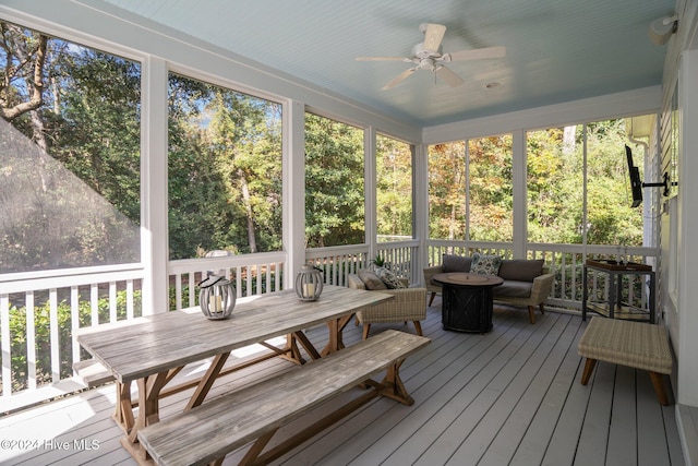 sunroom / solarium with ceiling fan