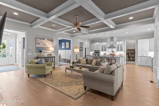 living room with beam ceiling, light hardwood / wood-style floors, crown molding, and coffered ceiling