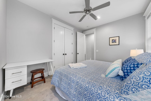 bedroom with light carpet and ceiling fan