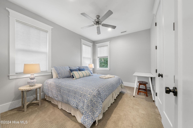 carpeted bedroom with ceiling fan