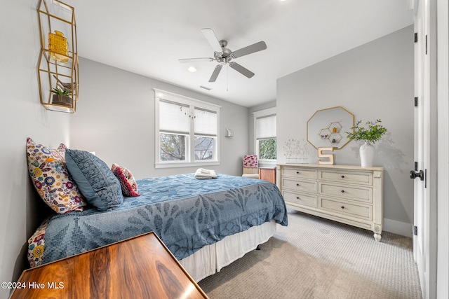 carpeted bedroom with ceiling fan