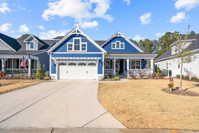 view of front of property featuring central AC unit, a porch, and a garage