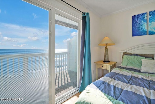 bedroom with hardwood / wood-style floors, a water view, and crown molding