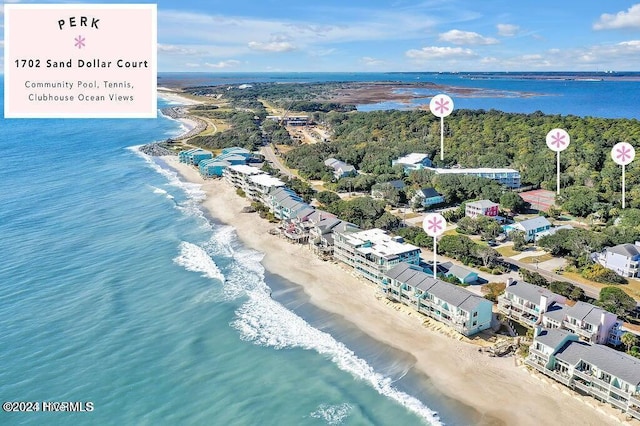 bird's eye view featuring a water view and a beach view