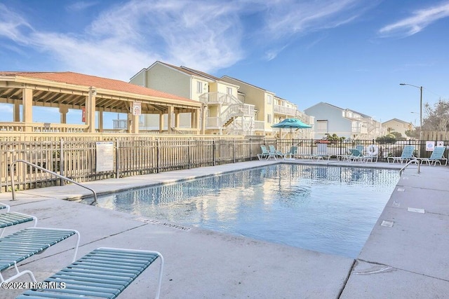 view of swimming pool featuring a patio area