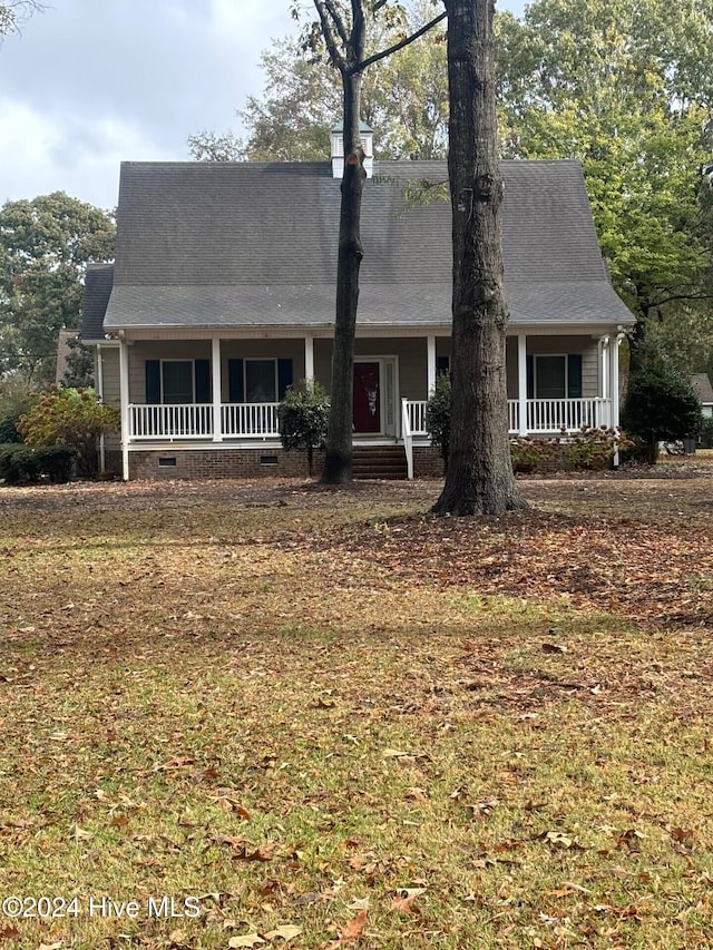 cape cod-style house with a porch