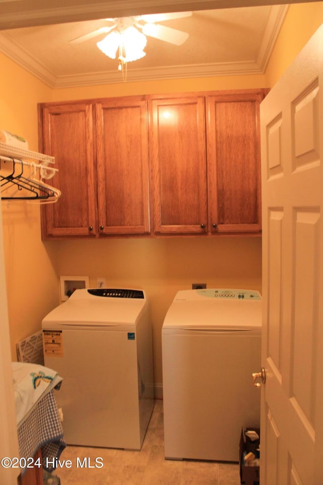 laundry room with washer and clothes dryer, ceiling fan, cabinets, and ornamental molding