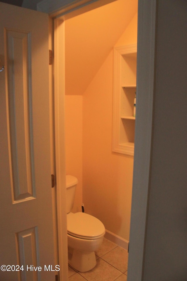 bathroom featuring tile patterned flooring and toilet