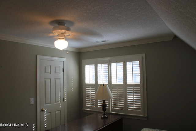 unfurnished office with lofted ceiling, a textured ceiling, and crown molding