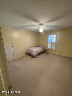 unfurnished bedroom featuring ceiling fan and light colored carpet