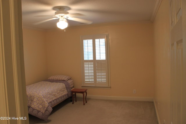 bedroom with ceiling fan, light colored carpet, and ornamental molding