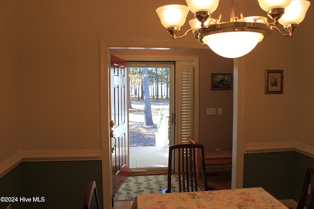 dining area with a notable chandelier