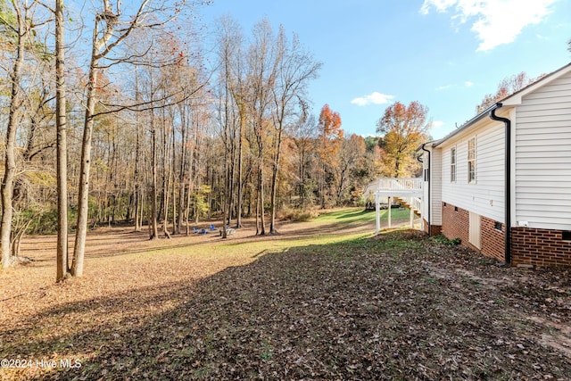 view of yard featuring a deck