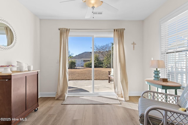 entryway featuring ceiling fan, plenty of natural light, and light hardwood / wood-style floors