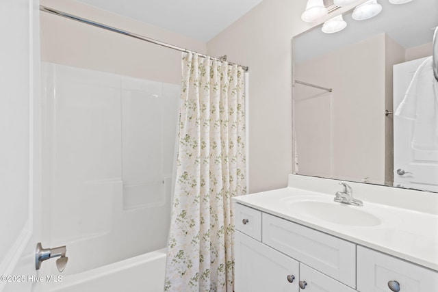 bathroom featuring vanity and shower / bath combo