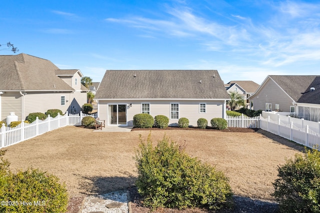 back of property featuring a yard and a patio