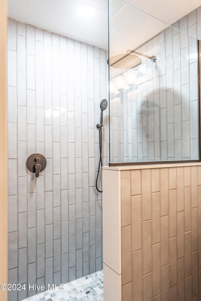 bathroom with tiled shower