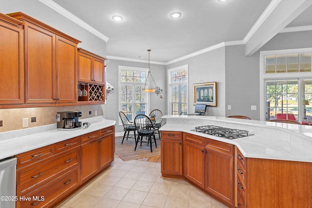 kitchen with gas cooktop, decorative backsplash, stainless steel dishwasher, and light countertops