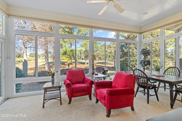 sunroom featuring ceiling fan