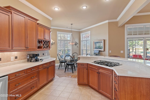 kitchen featuring brown cabinets, recessed lighting, ornamental molding, gas cooktop, and pendant lighting