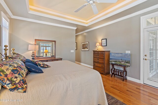 bedroom with crown molding, wood-type flooring, access to exterior, and ceiling fan