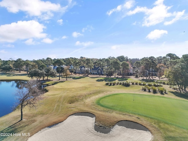 view of property's community featuring view of golf course and a water view
