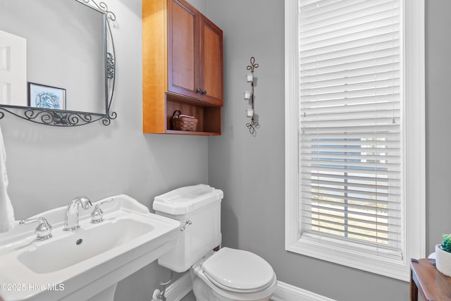 bathroom featuring toilet and a sink