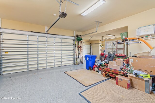 clothes washing area with washer / clothes dryer, sink, light tile patterned floors, and electric panel