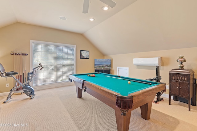 game room featuring a wall mounted air conditioner, lofted ceiling, baseboards, and carpet