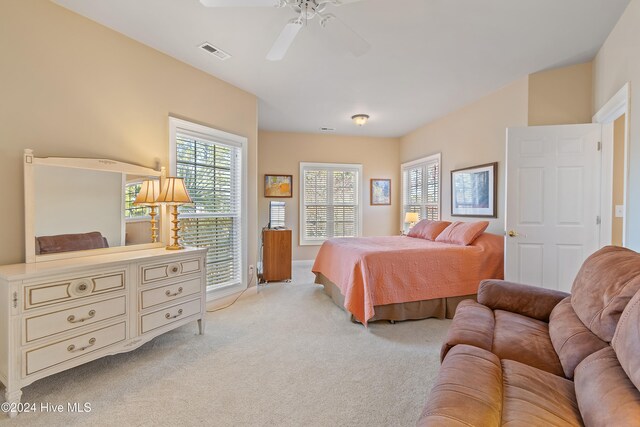 carpeted bedroom featuring ceiling fan