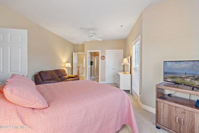 full bathroom featuring vanity, bath / shower combo with glass door, and toilet