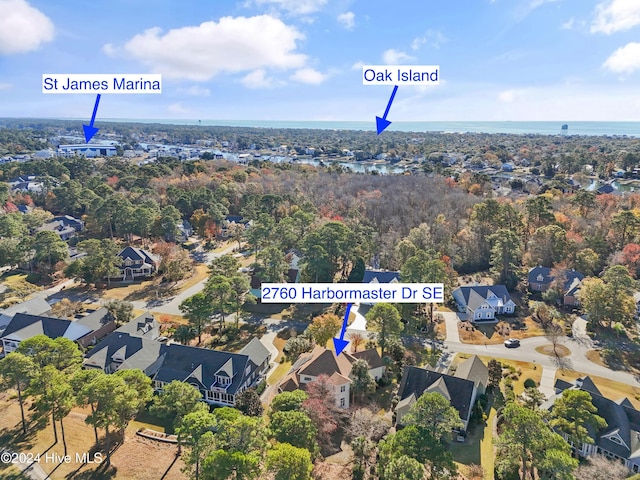 bird's eye view with a residential view and a water view