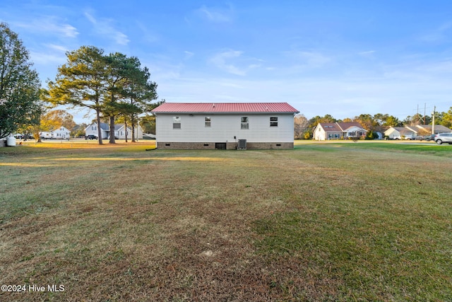 back of house with a yard