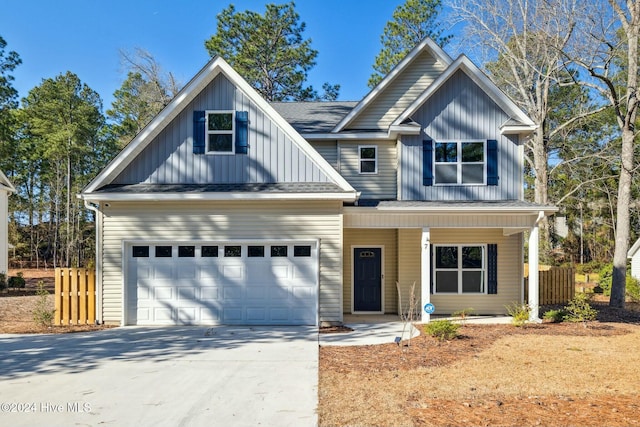 view of front of home with a porch and a garage