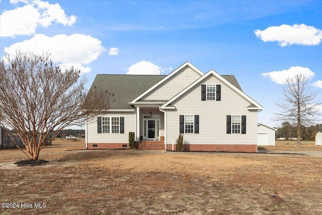 view of front of home featuring an outbuilding and a garage