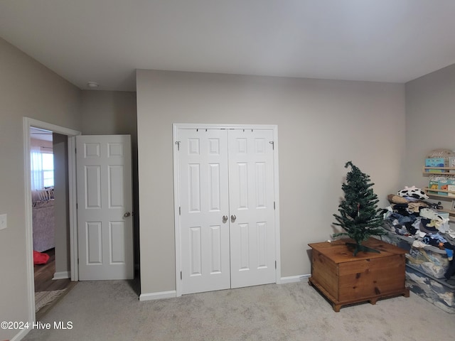 carpeted bedroom featuring a closet