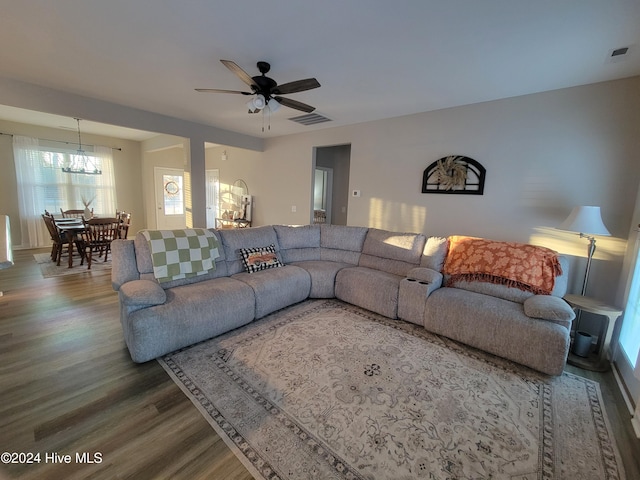 living room featuring wood-type flooring and ceiling fan