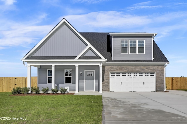 116 Talbert Dr, Rocky Point, NC 28457 - view of front of house featuring driveway, a garage, covered porch, and a shingled roof