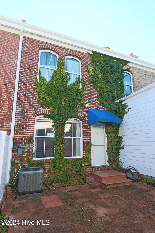 view of front facade with central AC