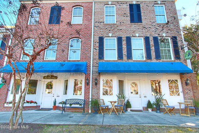 view of exterior entry featuring a patio