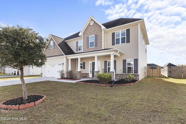 view of front facade featuring a front lawn, covered porch, and a garage