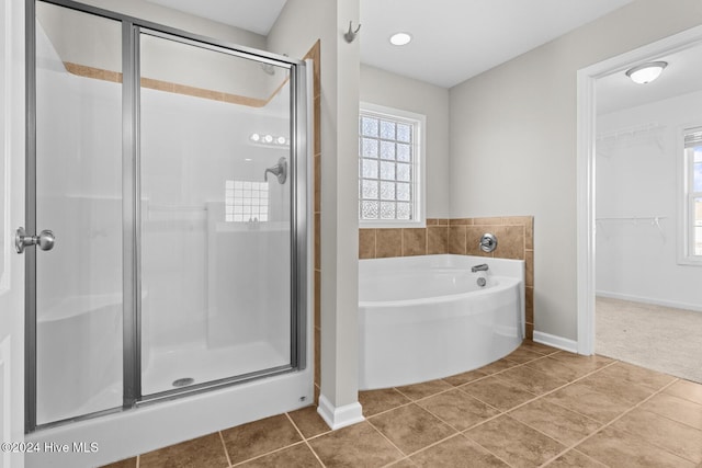 bathroom with plus walk in shower and tile patterned floors