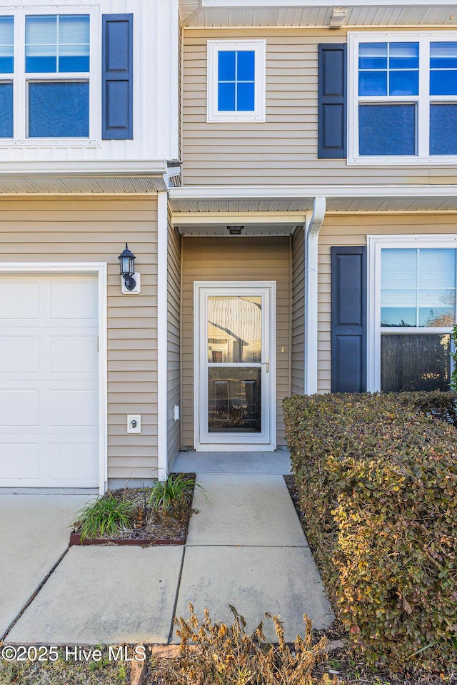 doorway to property featuring a garage