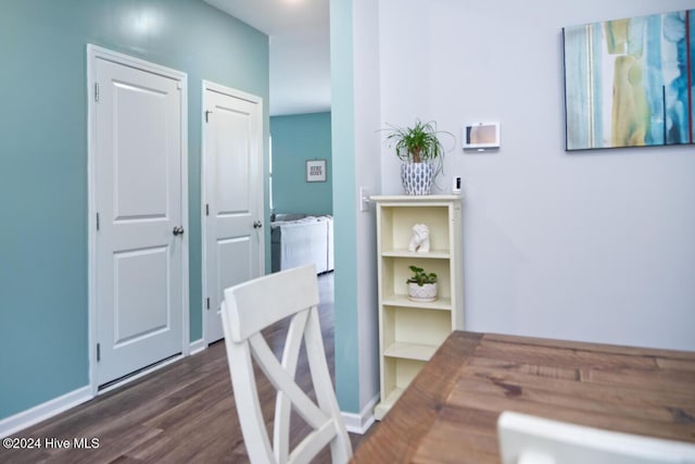 corridor featuring dark hardwood / wood-style floors