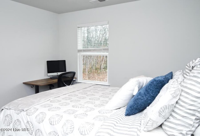 bedroom featuring multiple windows