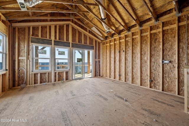 miscellaneous room with high vaulted ceiling