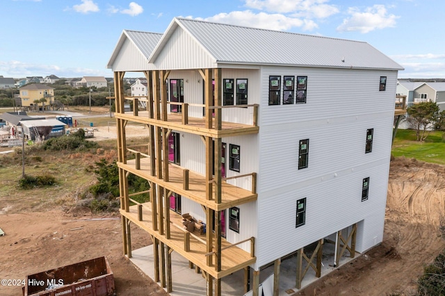 rear view of house with a balcony