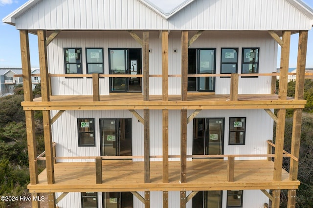 rear view of house featuring a balcony